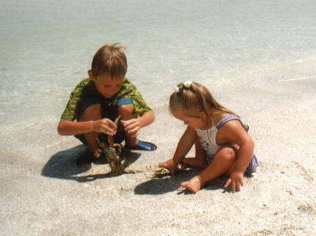 Mark n Mariah at Sanibel Beach playing with 2 crabs June 2001